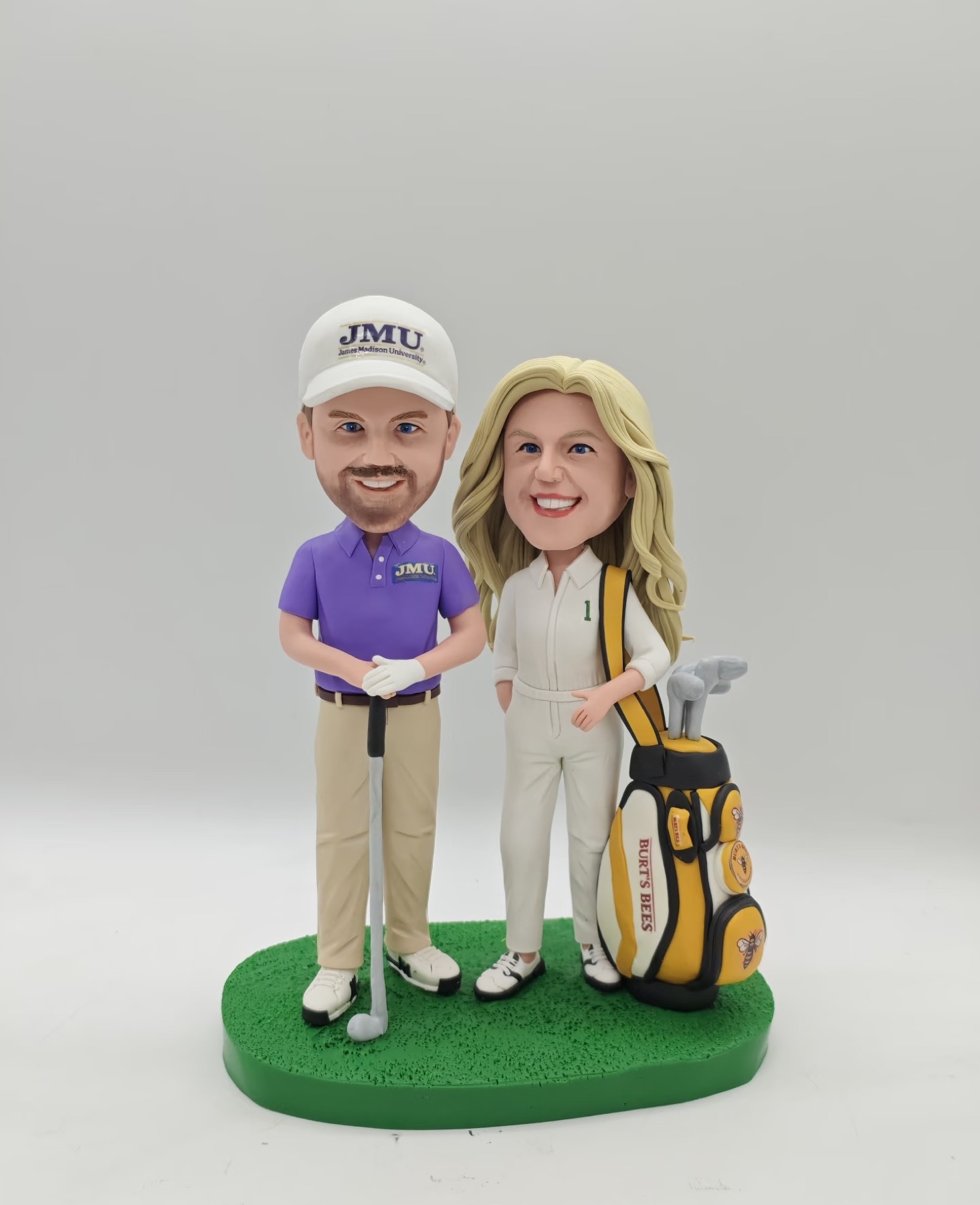 Custom clay portrait of a couple with their golf equipment