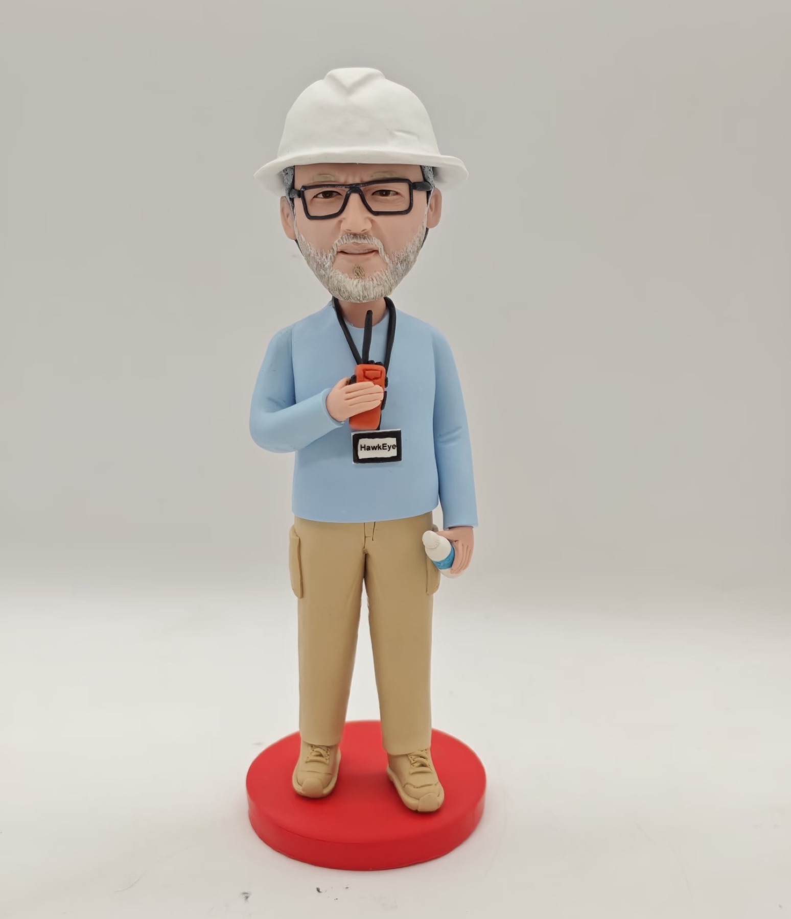 Clay portrait of a person in work clothes and a hard hat